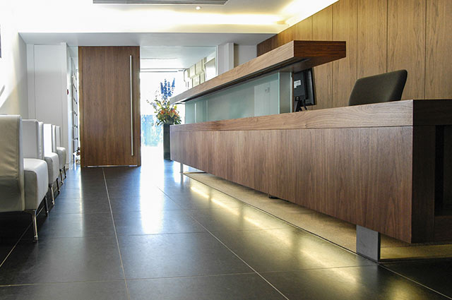 Bank reception area with bespoke counter and storage units